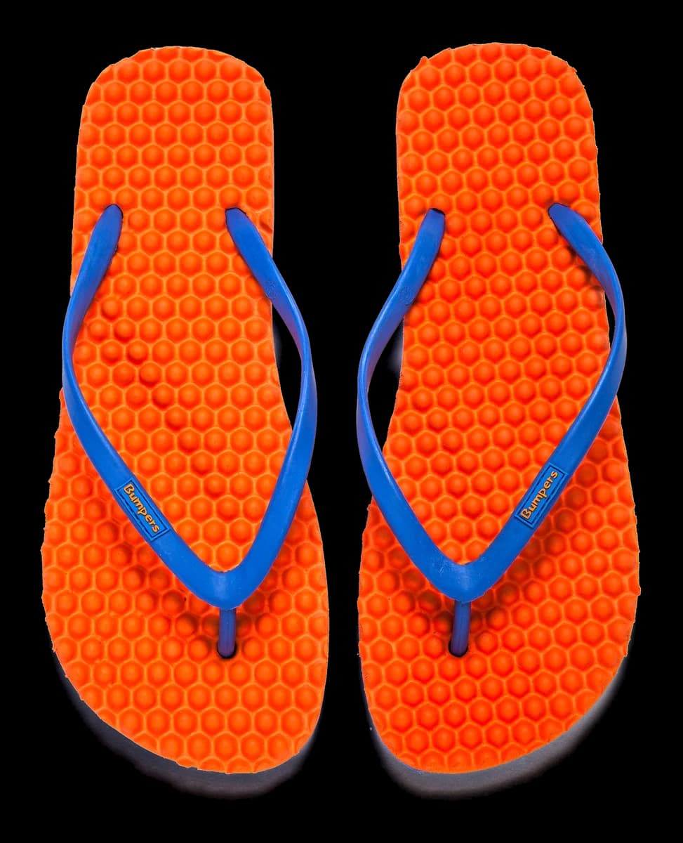 Bumpers product construction and colorful footwear supporting a responsible natural-rubber retail story